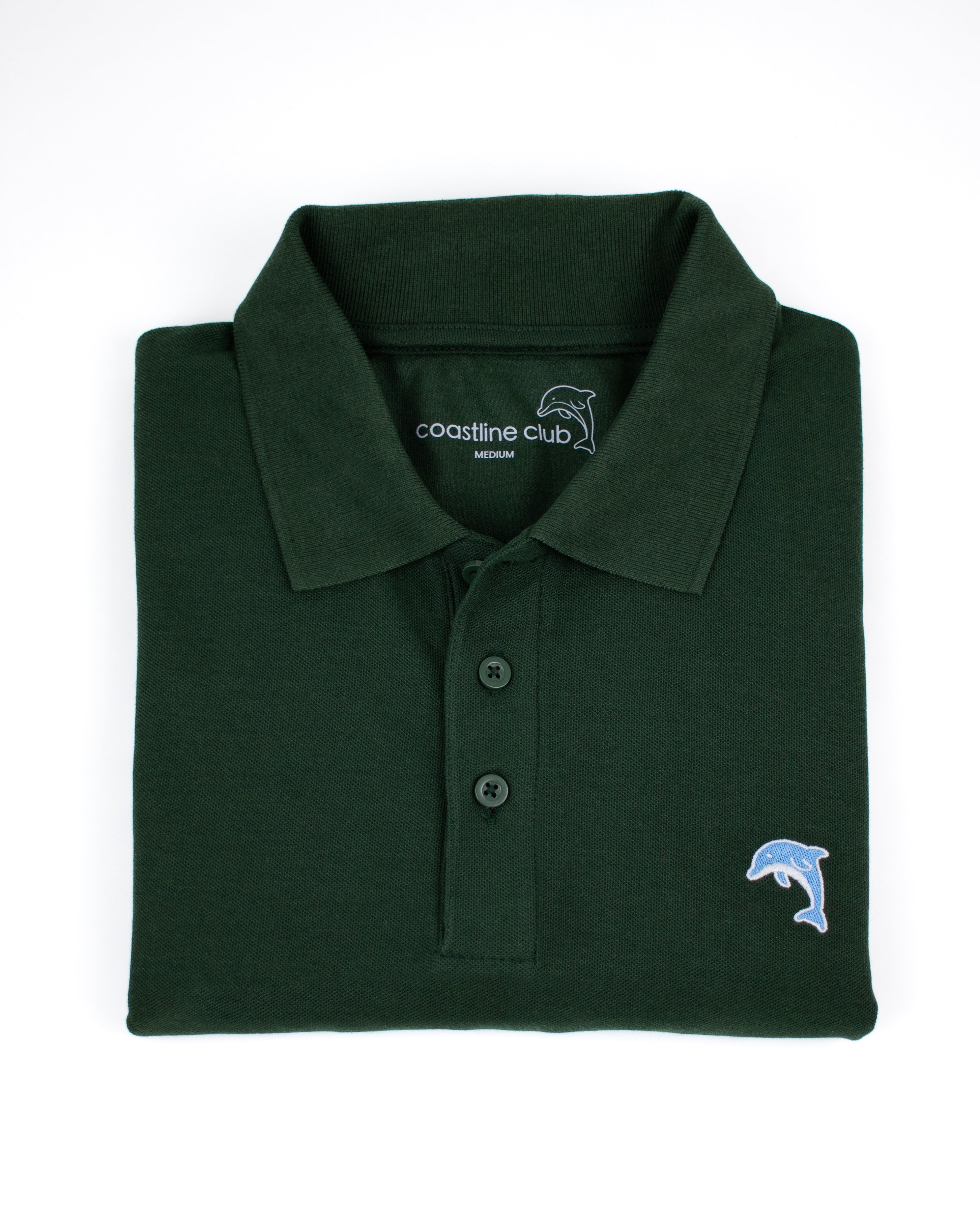 Folded green polo shirt with a dolphin logo on a white background