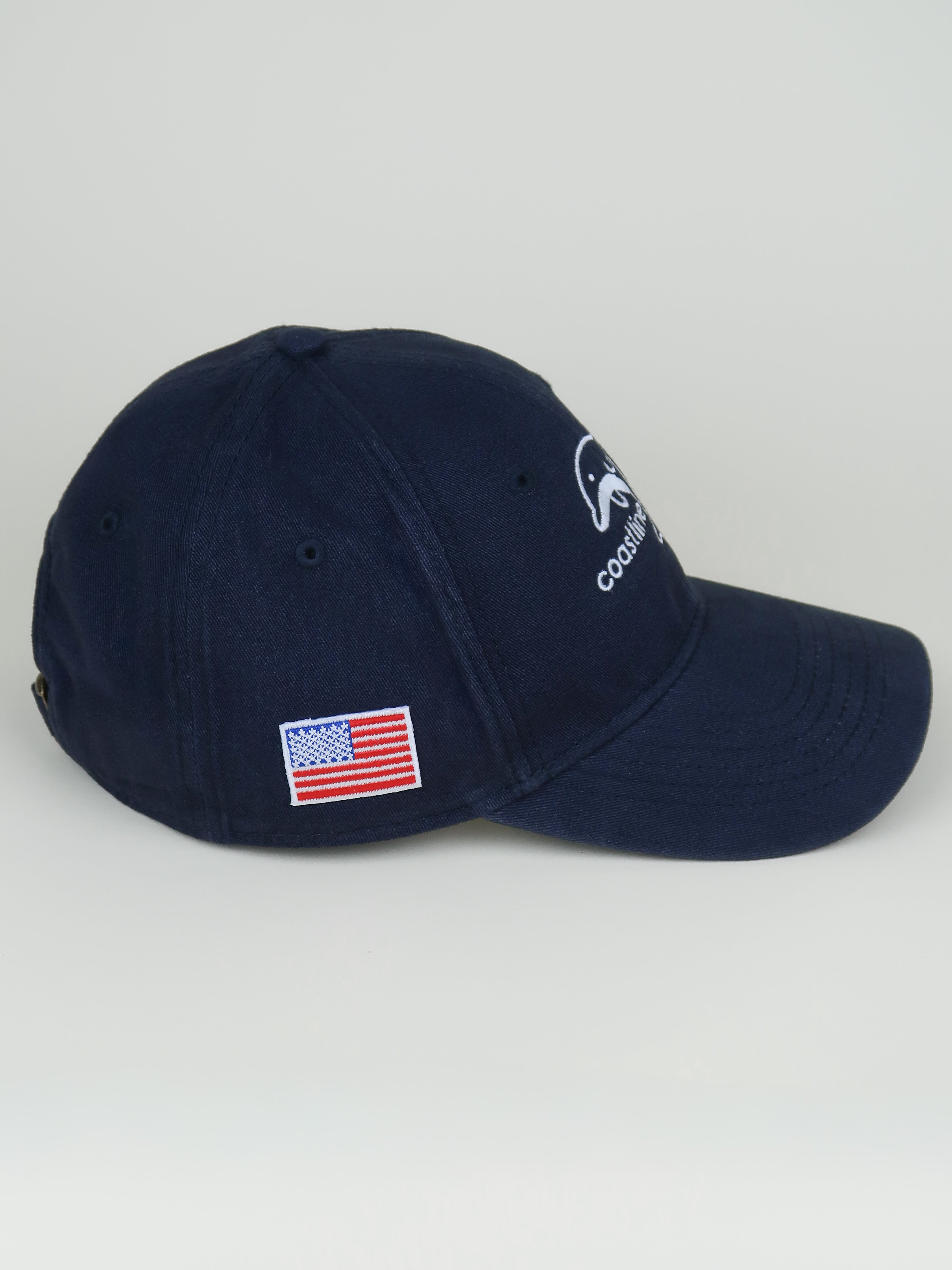 Navy blue cap with American flag patch on a light gray background