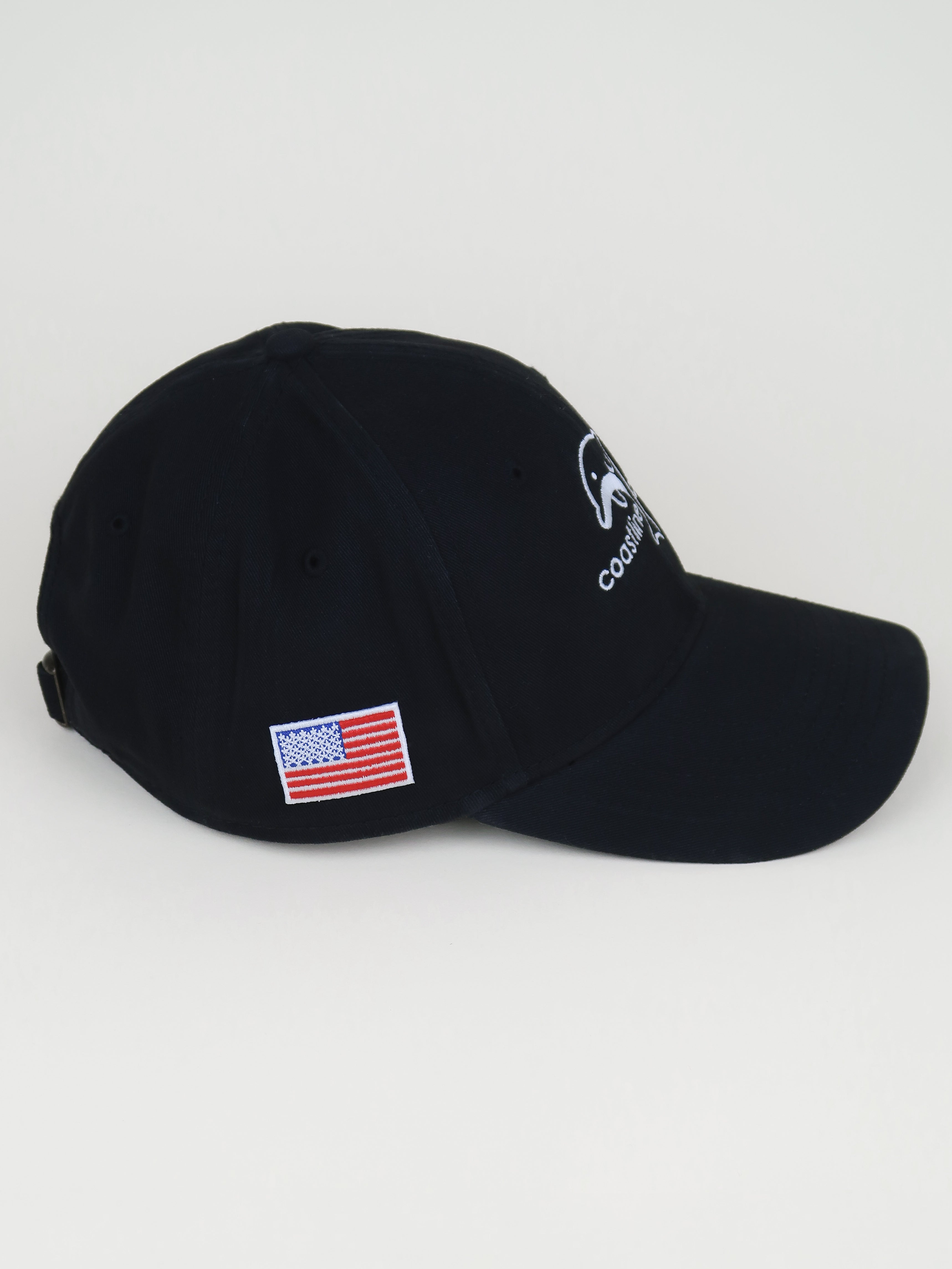 Black cap with American flag patch on a light gray background