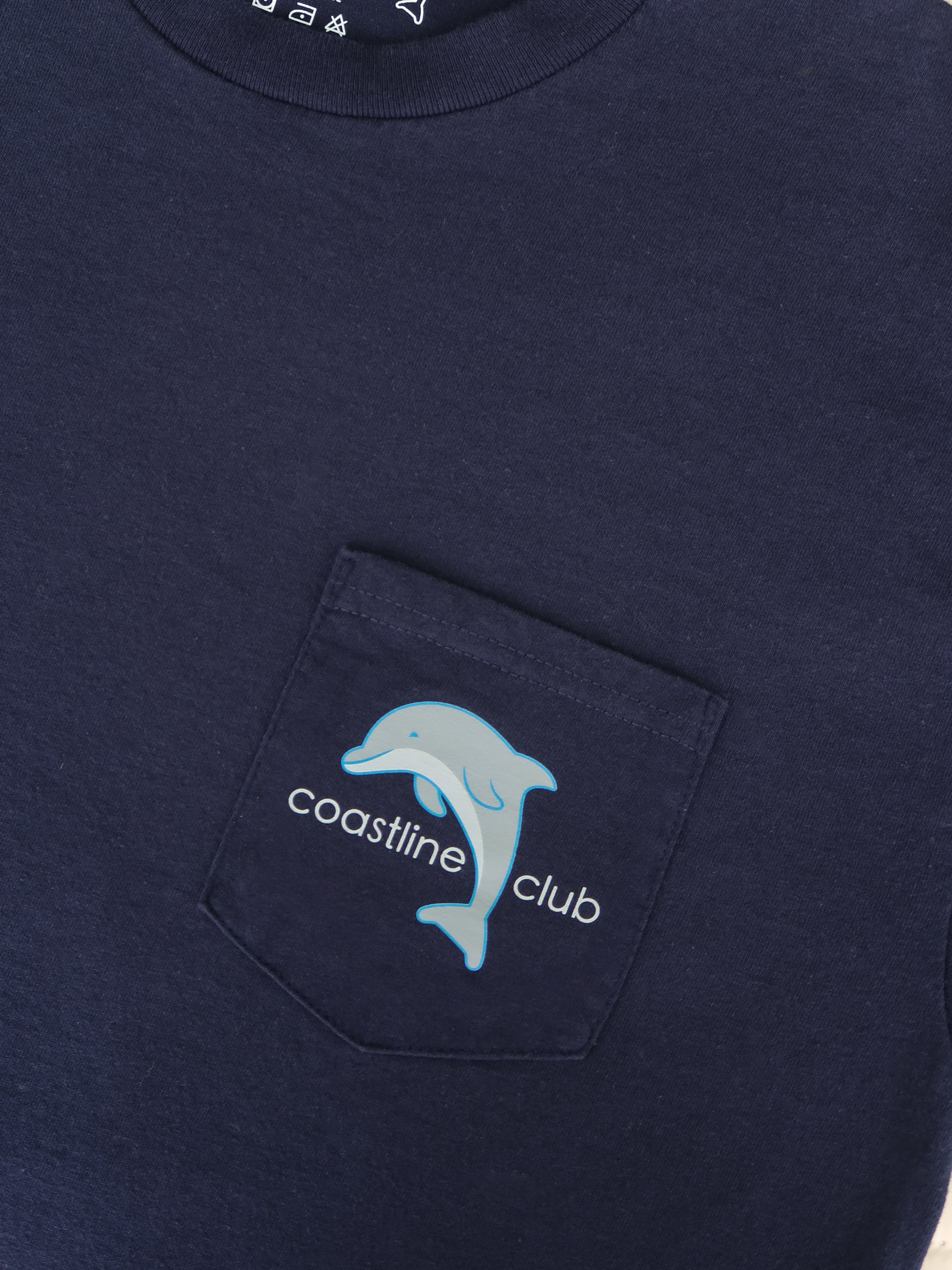 Navy blue shirt with a pocket featuring a dolphin logo and 'coastline club' text.